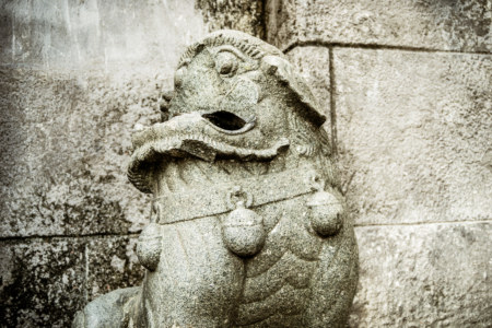 Broken stone lion in Intramuros