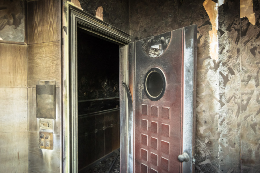 A scorched door at a fire-damaged KTV