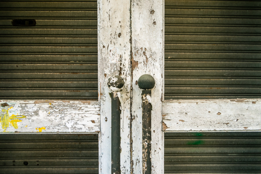 Metal shutters and wooden doors in Xizhou