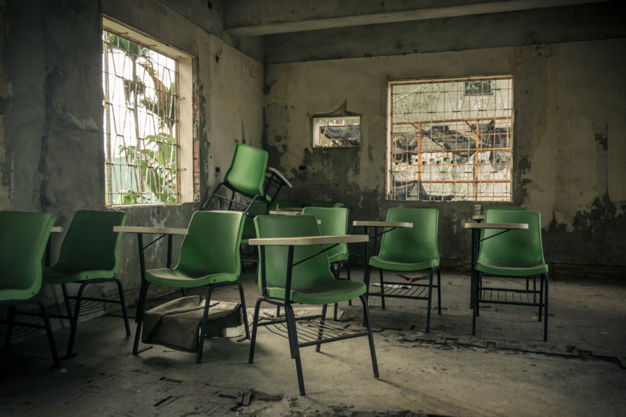Green chairs at the abandoned clinic