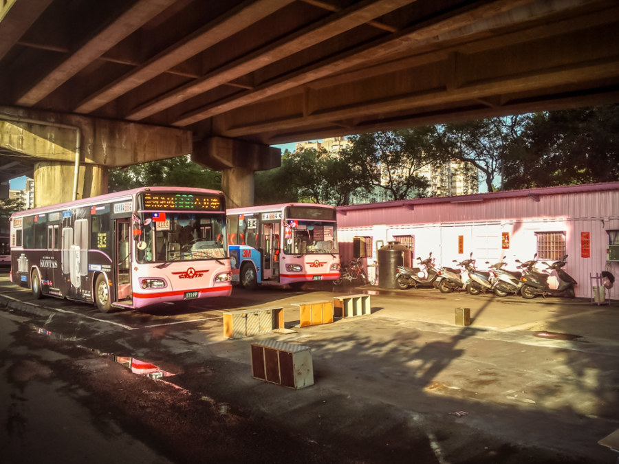 The pink bus depot under the highway in Jingmei