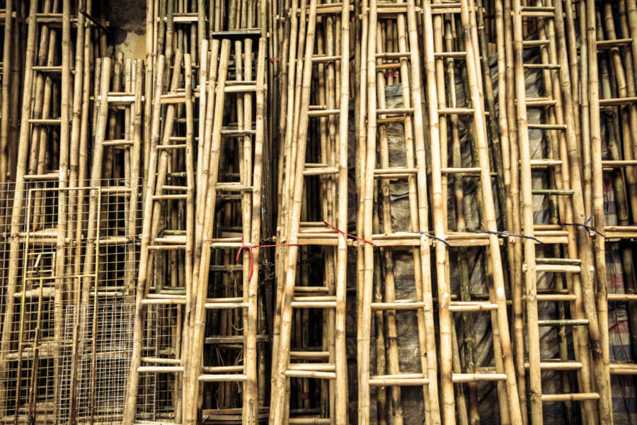 Bamboo ladders against a wall in the Old Quarter
